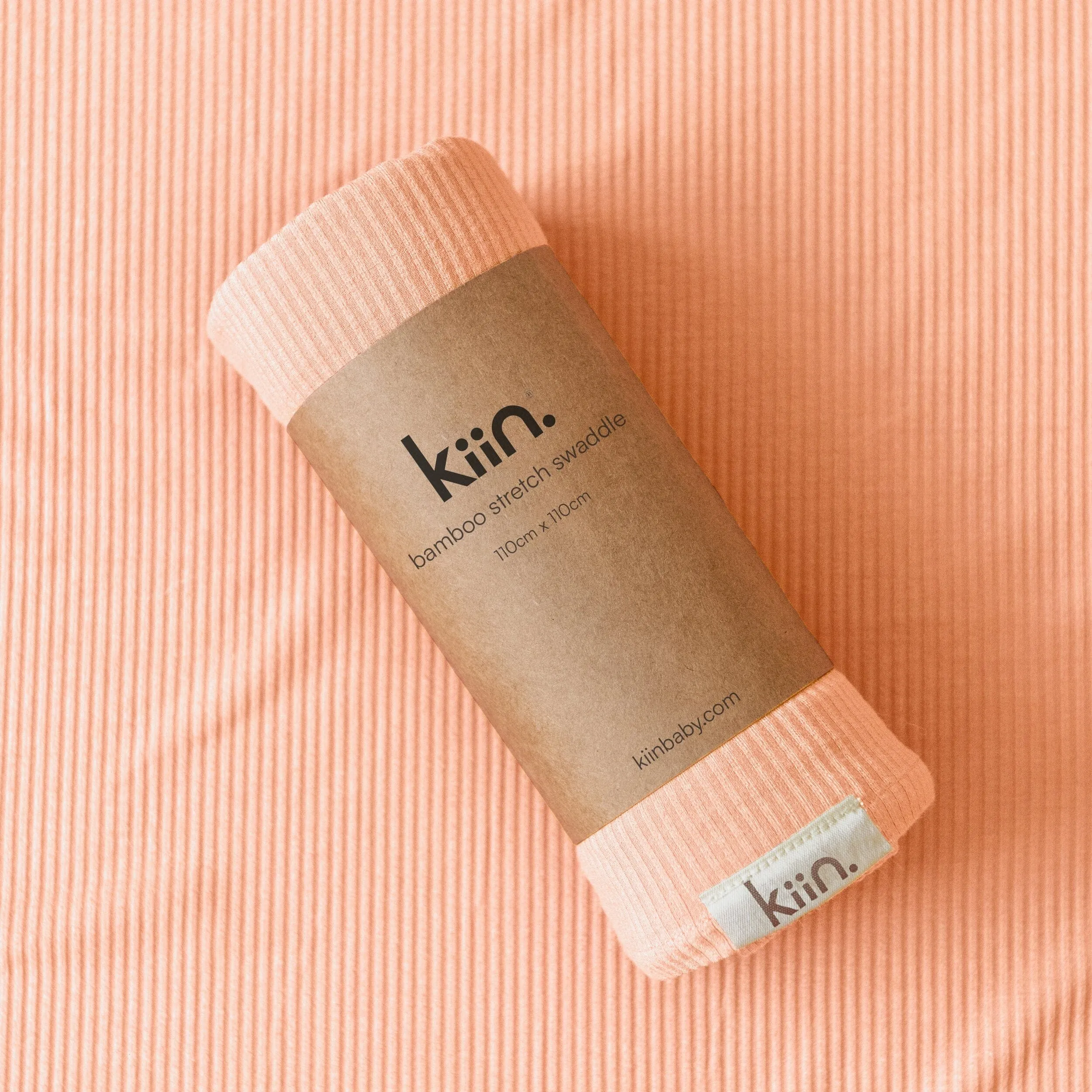 KIIN BAMBOO STRETCH SWADDLE: PEACH SUNSET